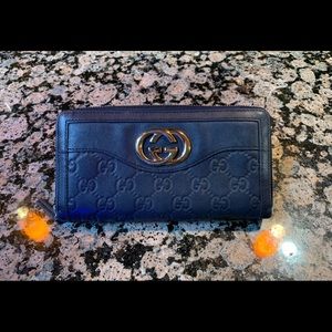 Gucci leather Guccissima zip around wallet